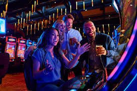slot game reels and casino table games on mobile screen